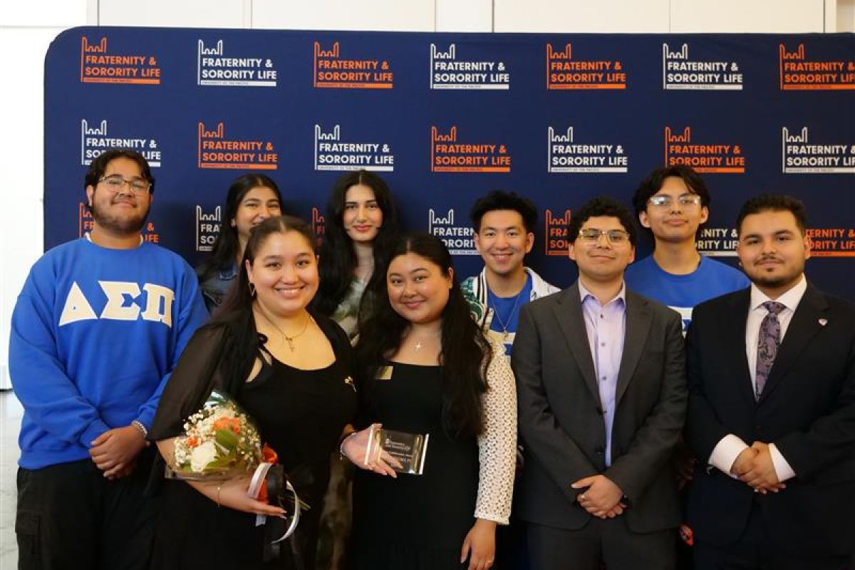 Photo of students in front of FSL backdrop