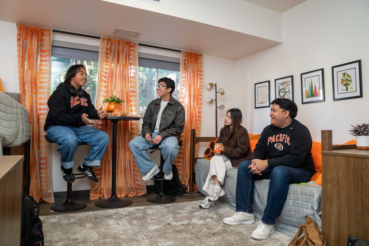 a group of students in a dorm room