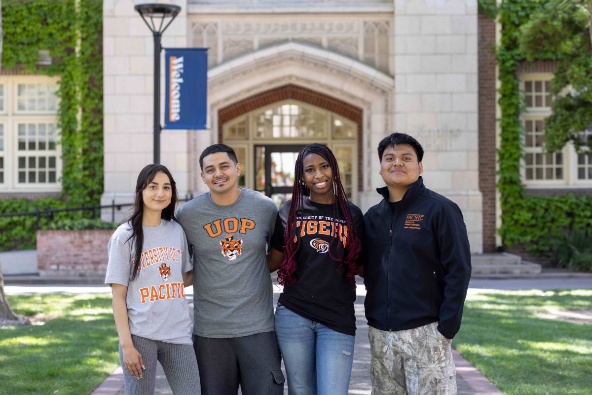 students stand in front of Knoles Hall