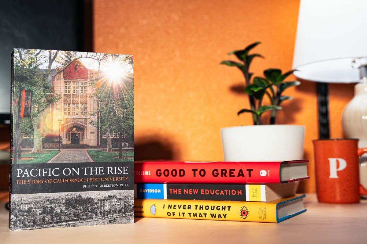 a stack of books on a desk