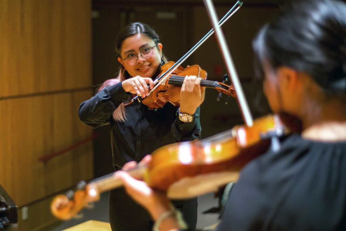 Violin students performing