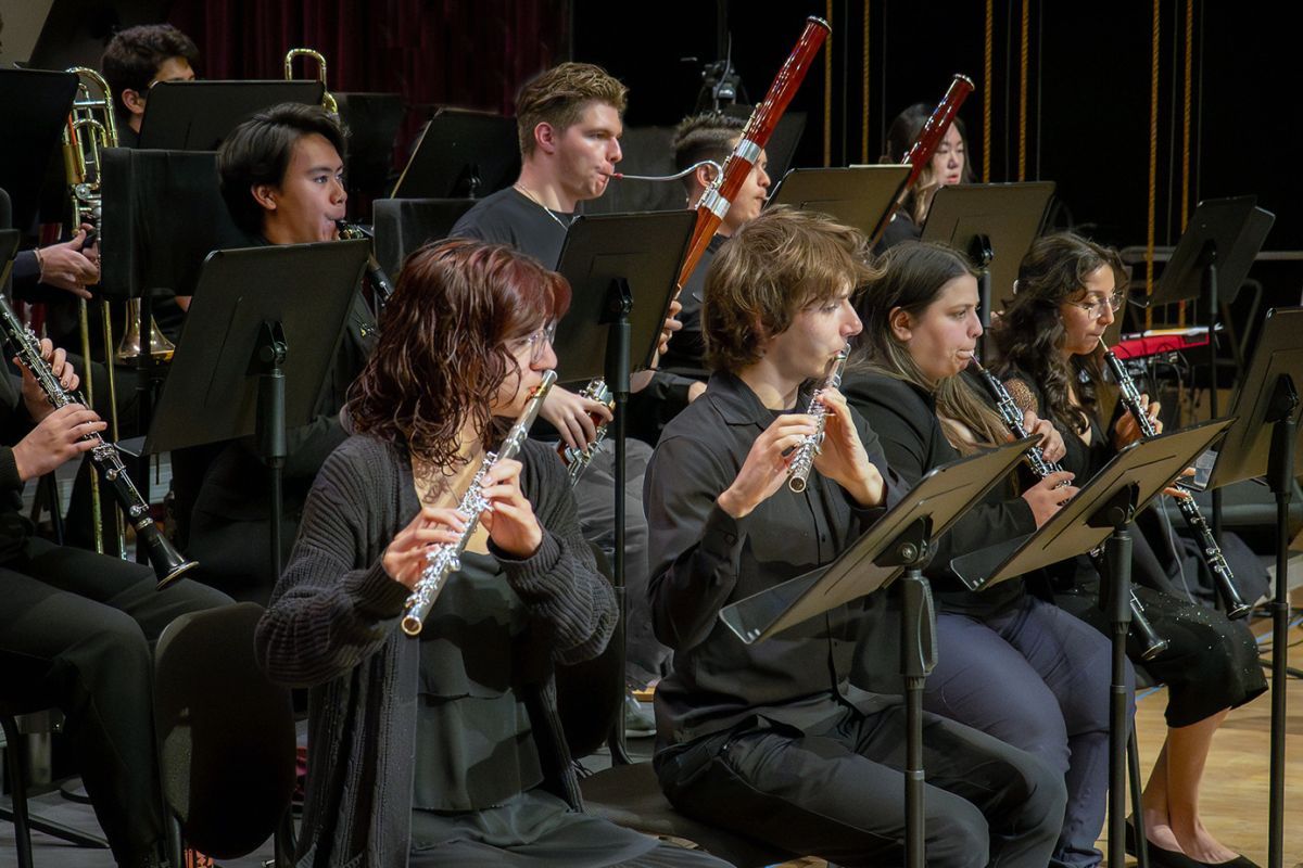 Students in a woodwind section of a University of the Pacific's orchestra ensemble