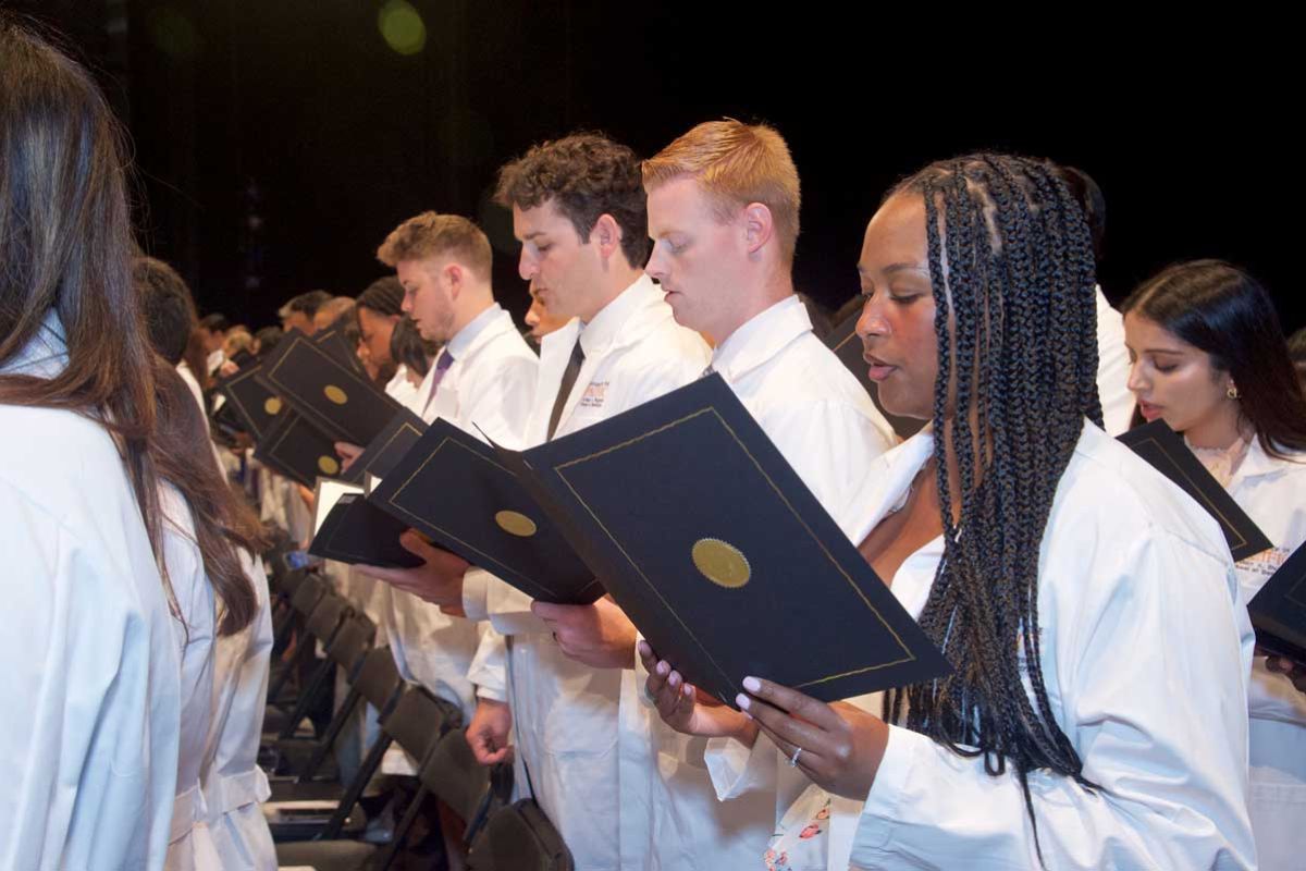 Students reciting oath at White Coat Ceremony
