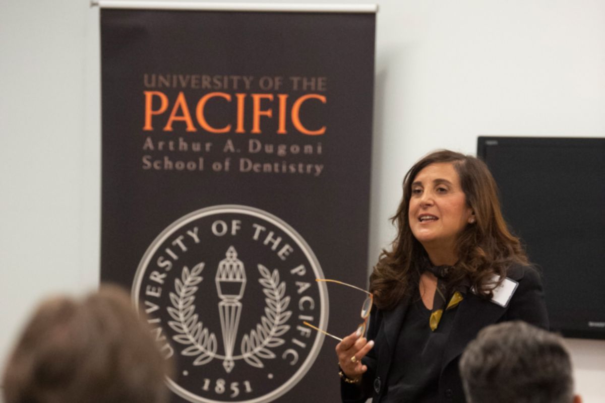 Dr. Moazzez at a podium