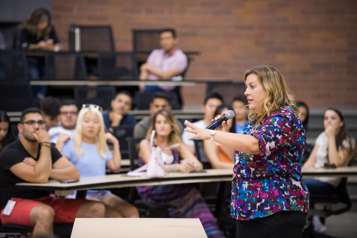 Photo shows PA Department Chair Dr. Tracey DelNero speaking in front of a class. 