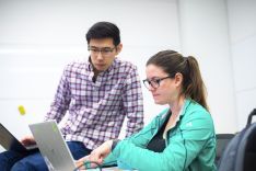 students looking at laptop