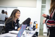 students smiling at each other