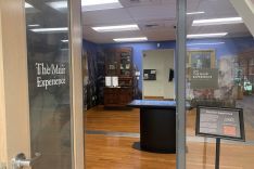 Entrance of the Muir Experience, with the touch table, back room, and desk visible through the door