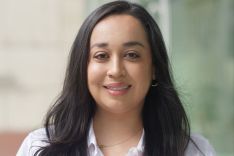 Maritza Perez is a women with a white shirt, and brown hair