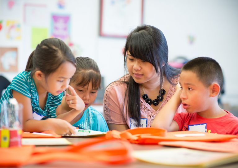 Pacific Student volunteering for literacy program