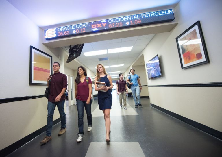 business students walk in the hallway of Weber Hall