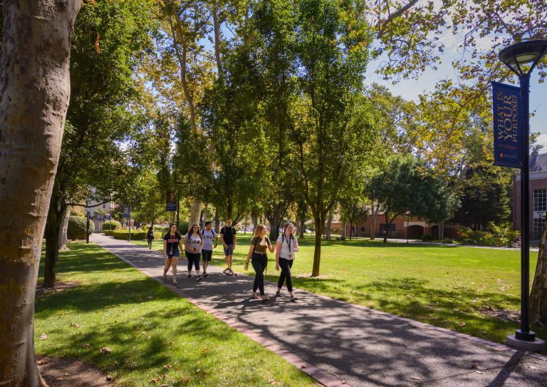 students walk on campus