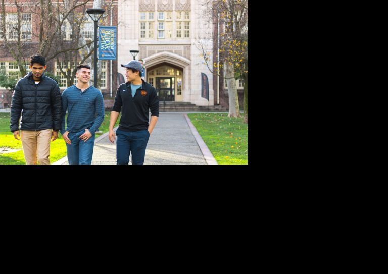 students walk in front of Knoles Hall