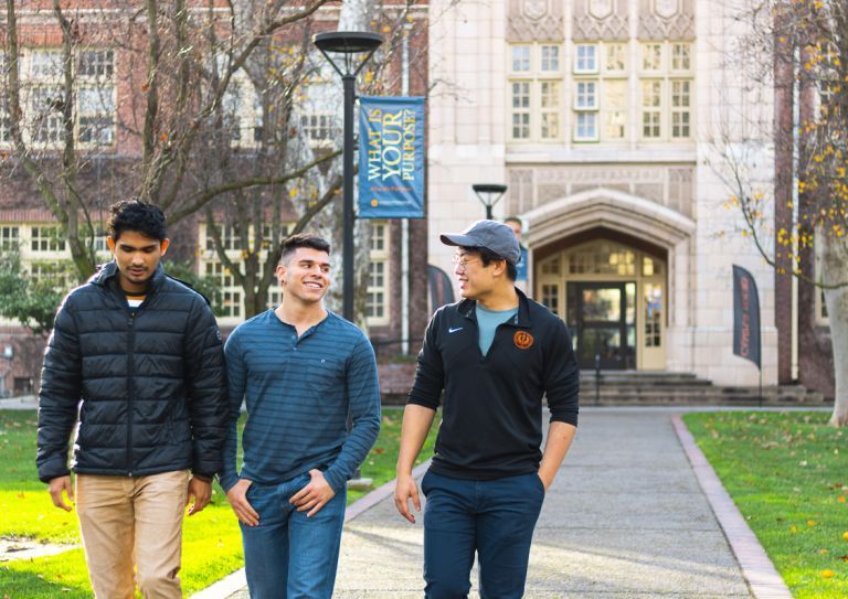 students walk in front of Knoles Hall