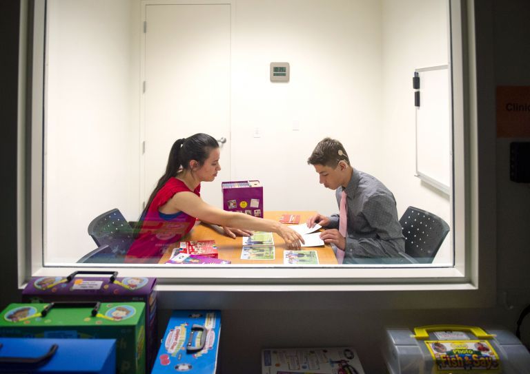 student working with a patient