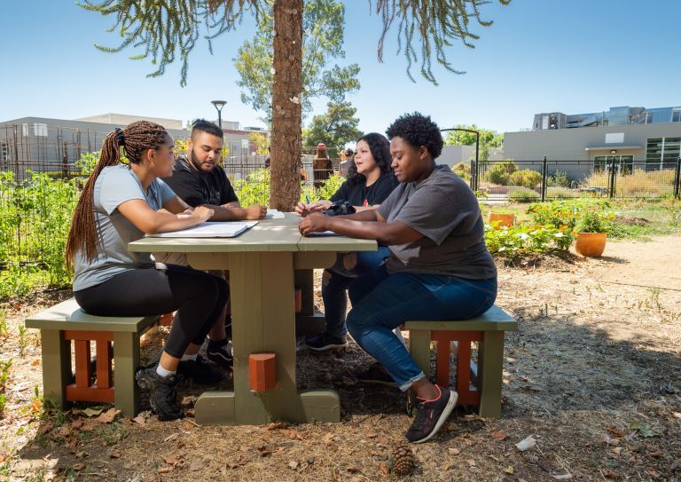 students sitting in Robb Garden