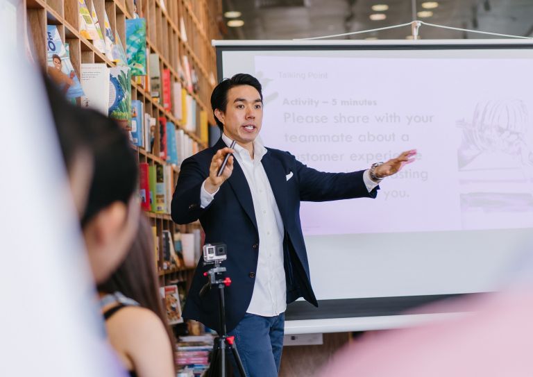 Businessman speaking to group
