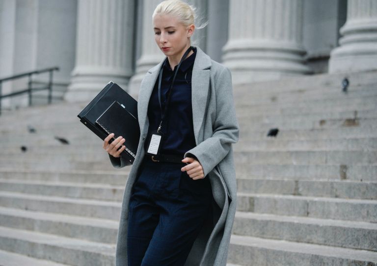 woman walking down court steps