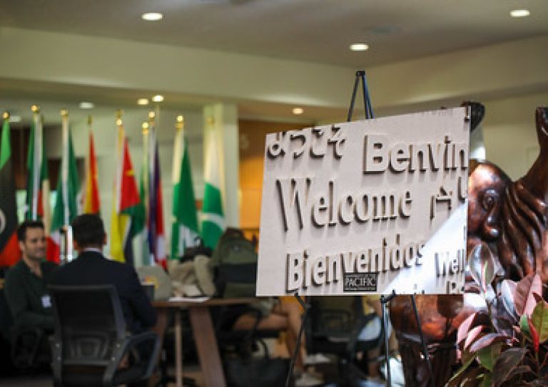 signage that says welcome in multiple languages