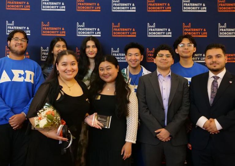 Photo of students in front of FSL backdrop