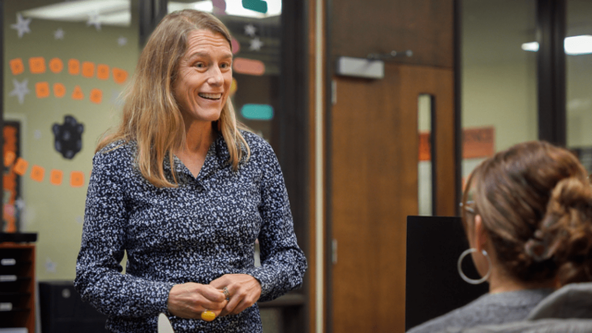 Lee Skinner talks to a staff member in College of the Pacific