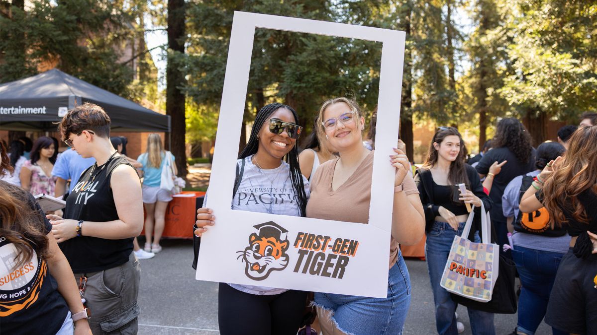 Students pose for a picture inside a white frame labeled "First-gen Tiger"