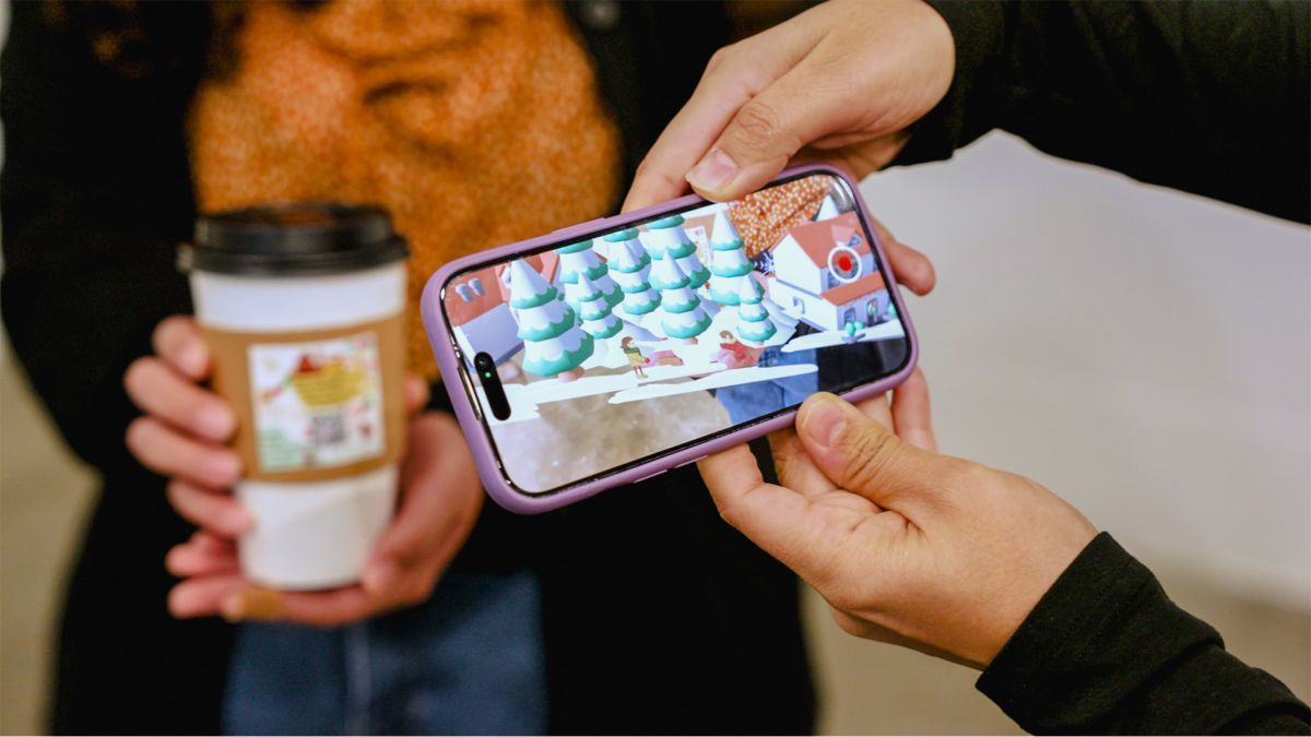 a person scans a QR code on a coffee cup