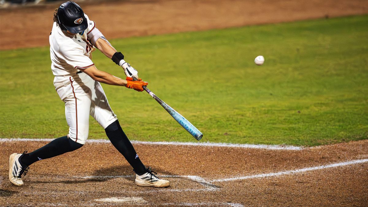 a baseball player hits the ball 