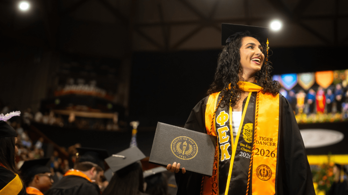 A graduate with her degree