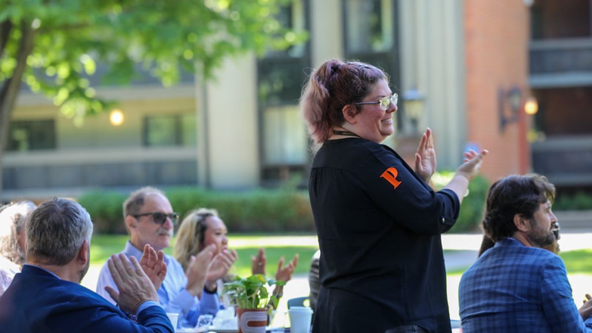 Audience applauds at Years of Service event