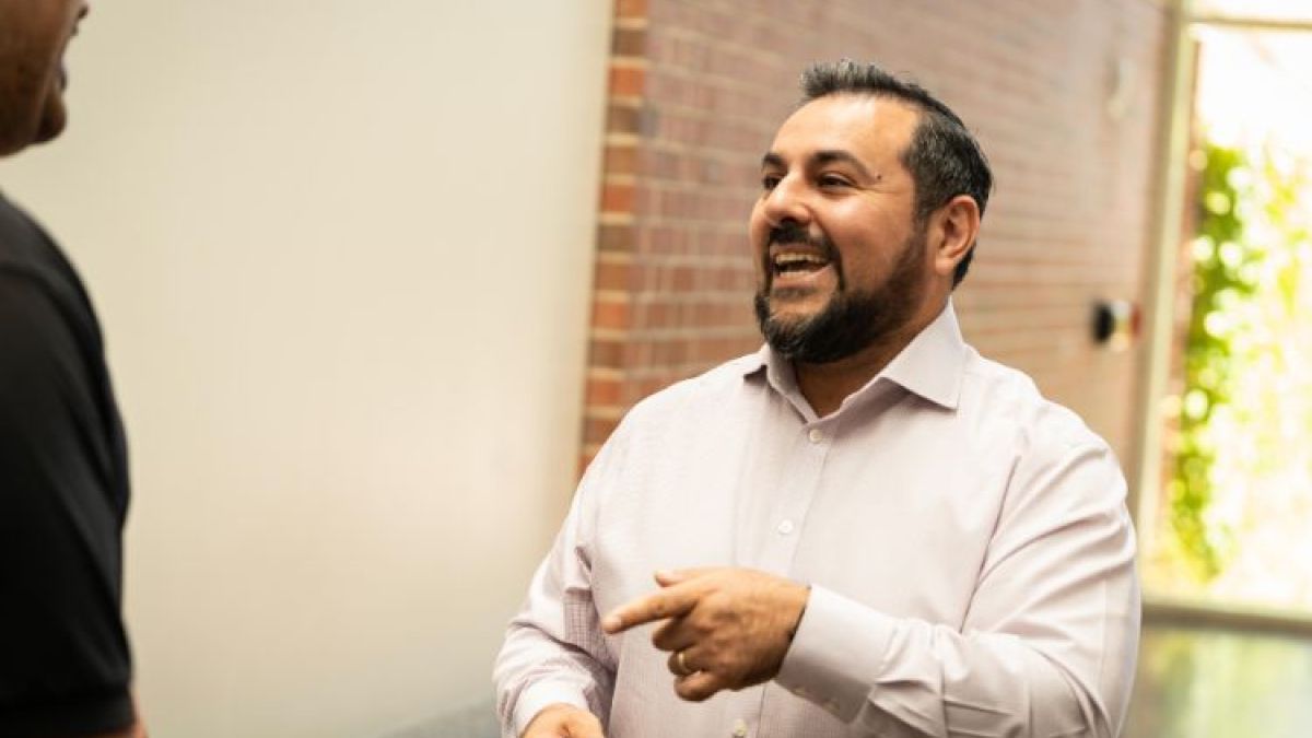 Marco Alvarado interacting with a student 