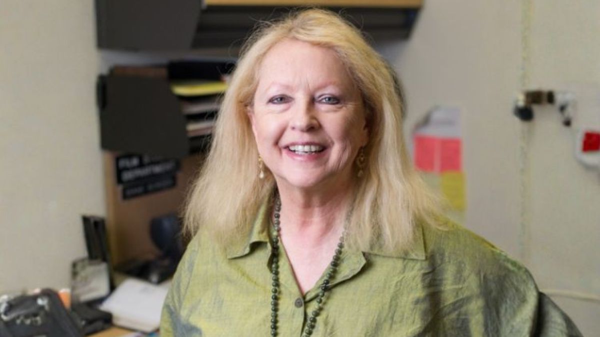 Diane Borden smiling in a classroom