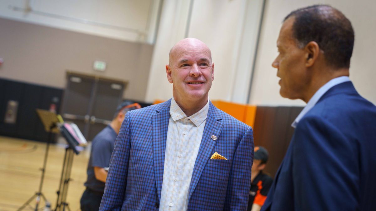 Dave Smart smiling in a blue suit