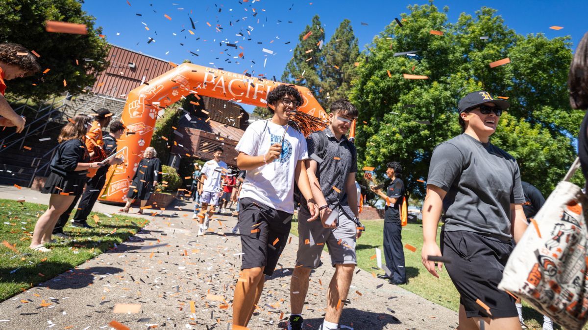 Pacific students at Tiger Roar walking through confetti 