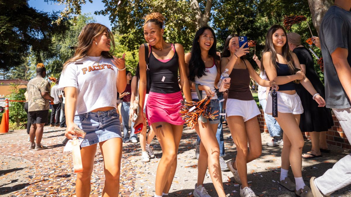 Students walking through confetti