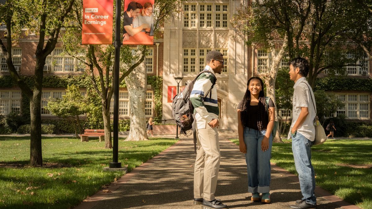 Students talking in a group outside of Knoles Hall