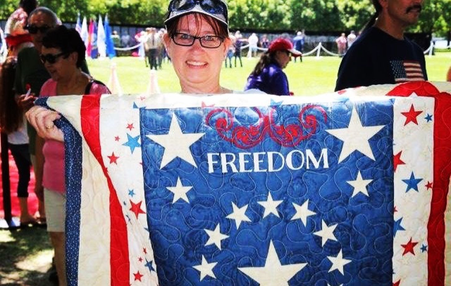 Linda Vasquez with a quilt