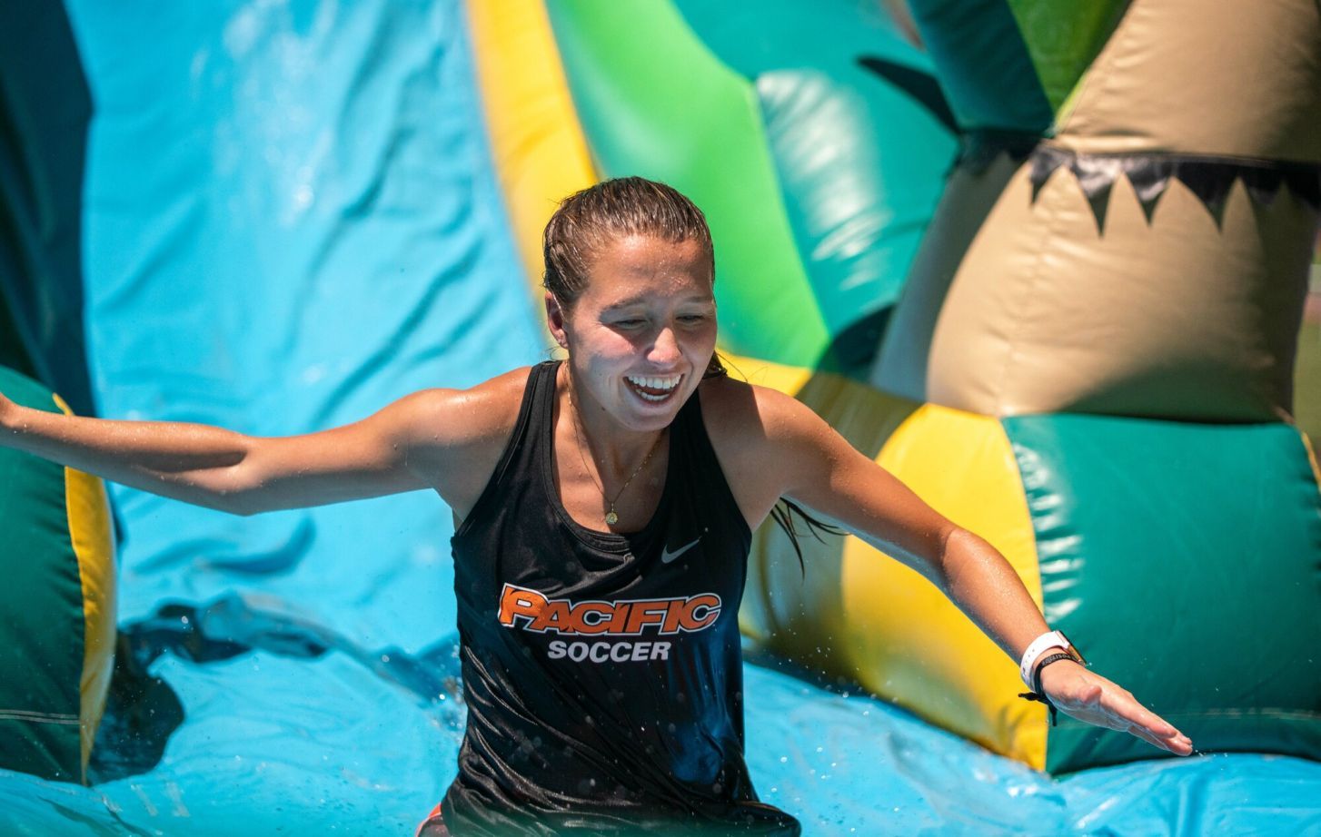student on water slide