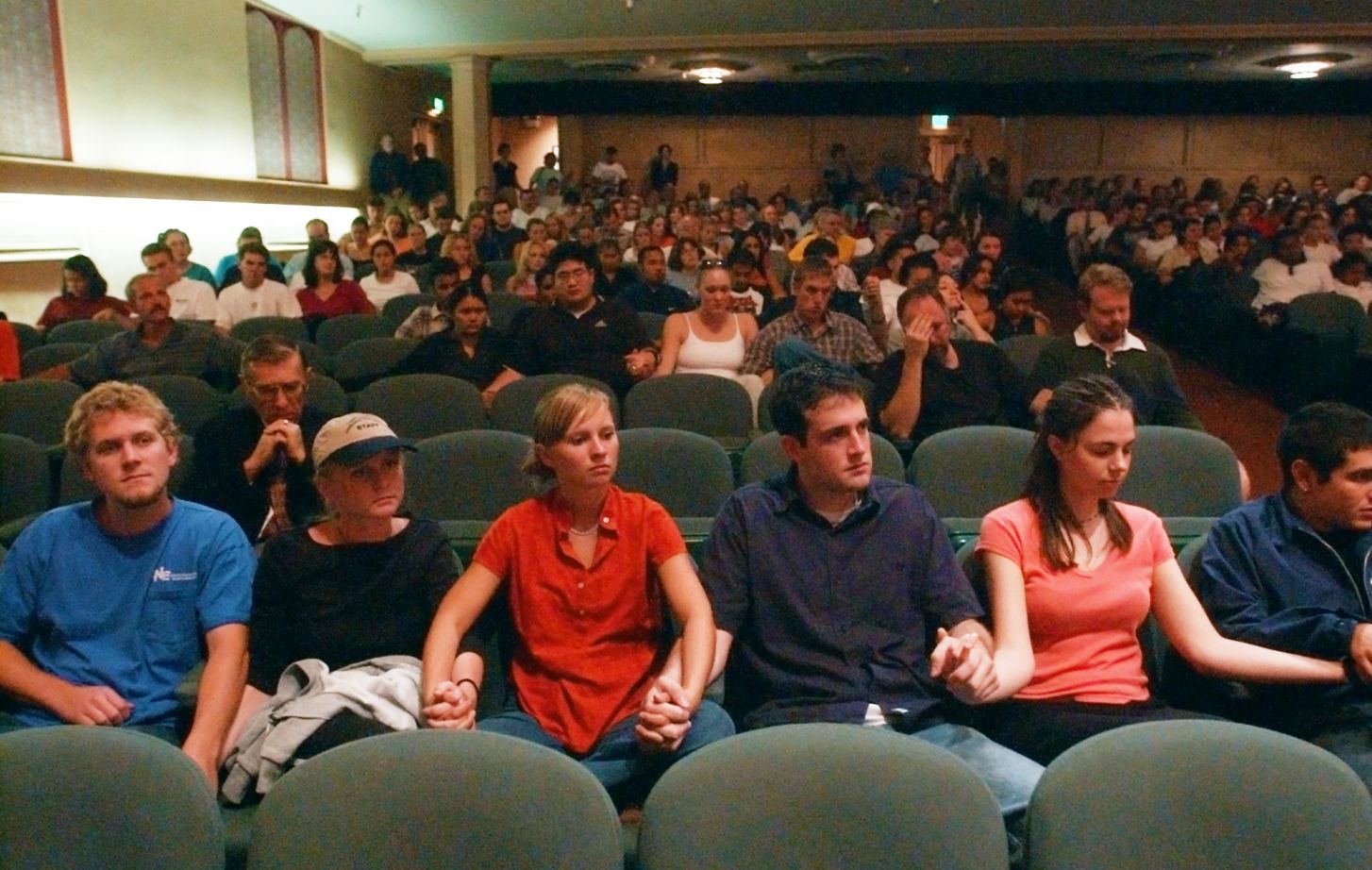 Pacific student holding hands