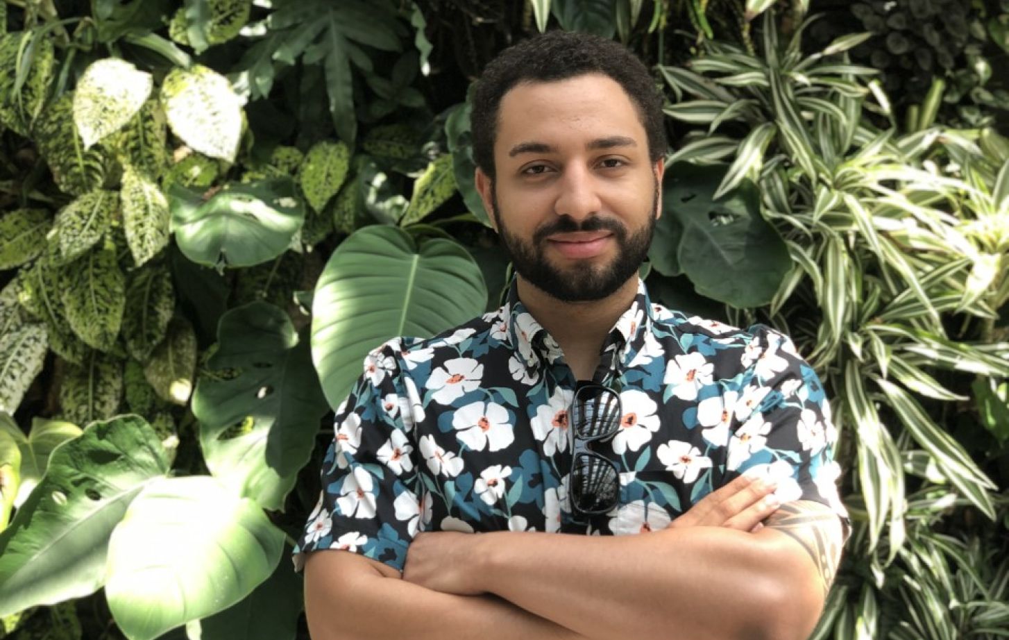 Nick Vaughn portrait in front of leaves.