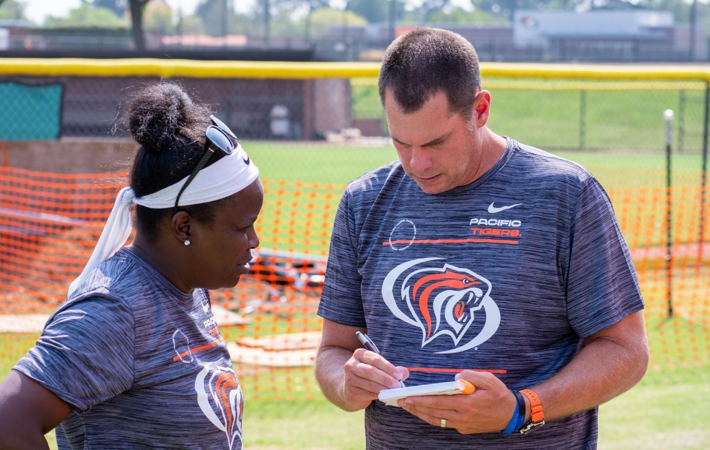 Women's soccer co-head coaches Danesha Adams and J.J. Wozniak.