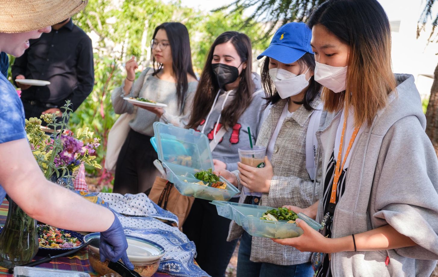 Students served food in Robb Garden