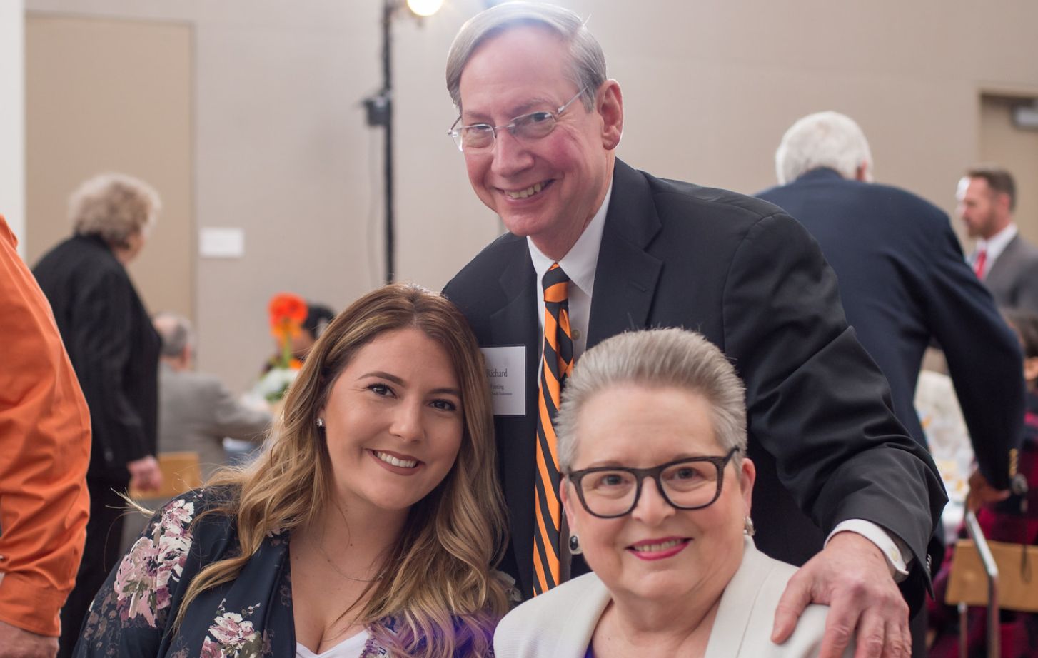 Photo of scholarship recipient with Rick and Diana Fleming