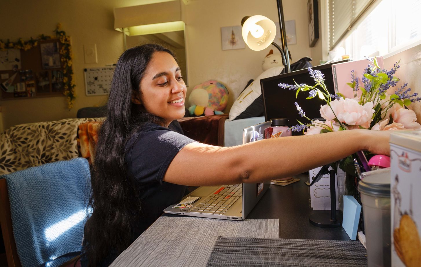 A student sits at a desk