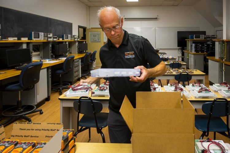 Mark Forman packing ECPE lab kits.