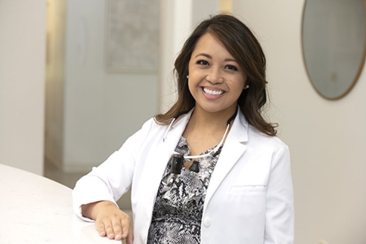 Sharon Manaois ’08, ’12 at her dental practice in Stockton.