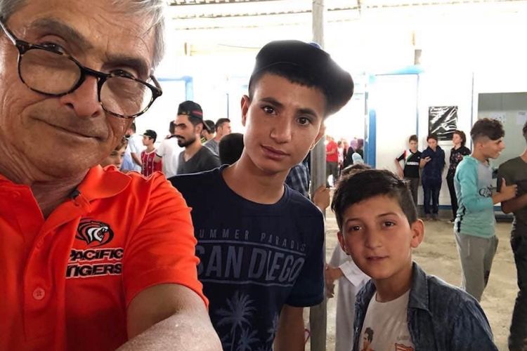 Stan Rapada (left) met many children at Iraqi refugee camps.