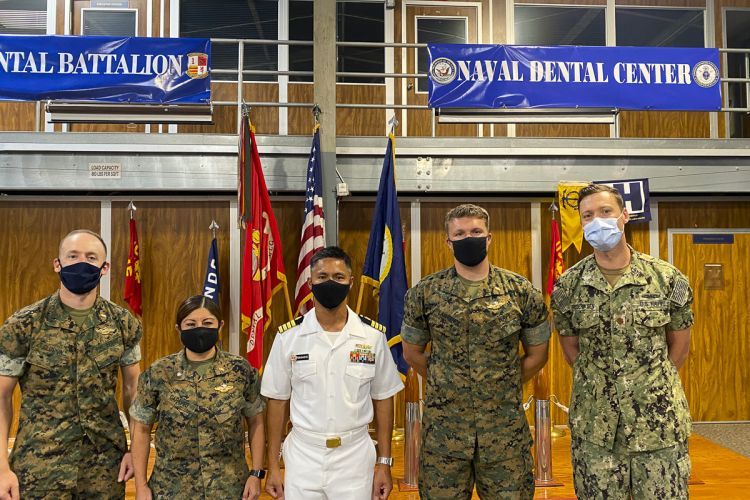 Left to Right: Lieutenant Adam Gluskin ’17, Commander Sherry Caraveo ’04, Captain Jerome Ragadio ’03, Lieutenant Michael Lawrence ’16 and Lieutenant Commander Eric Frederiksen ’11. (Not pictured: Lieutenant Commander Michael DeFazio ’13)