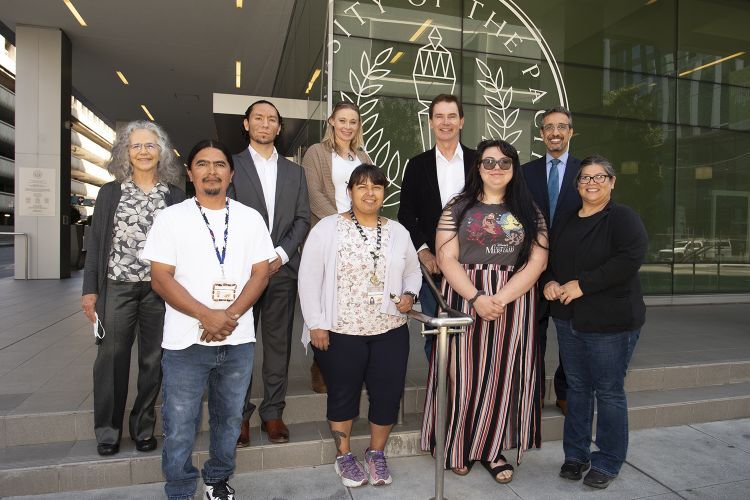 Group of tribal participants standing in front of the Dugoni School of Dentistry