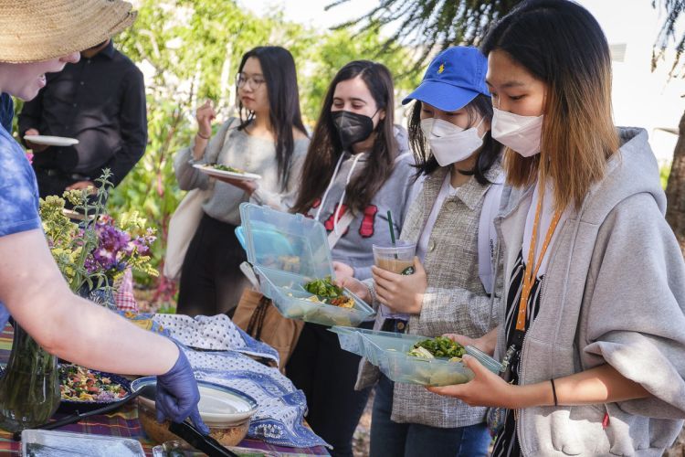 Students served food in Robb Garden